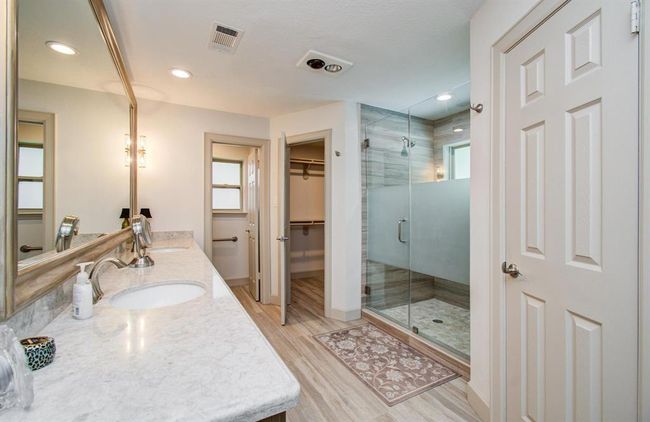 Completely upgraded ensuite bathroom features an oversize shower with frameless glass. | Image 23