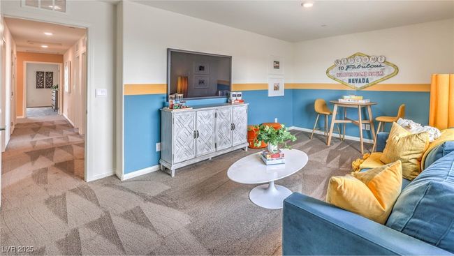 Photo is representational only; actual home finishes may vary. Carpeted living room with baseboards and recessed lighting | Image 16