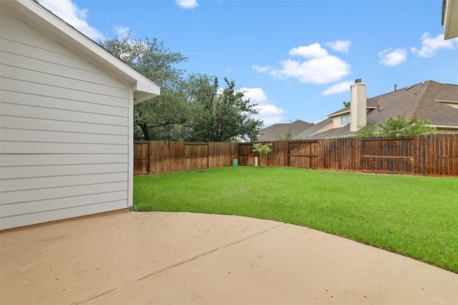 The backyard also features a large patio which is perfect for outside entertaining! | Image 26