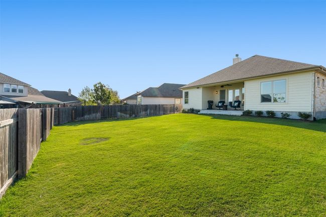 Mature landscaping provides privacy, and the HOA maintains the front yard for added convenience. | Image 33