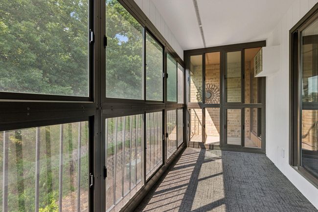 Bright 3-season porch offering a cozy retreat and plenty of natural light | Image 11