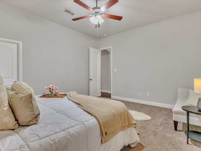 Carpeted bedroom featuring baseboards and ceiling fan | Image 16