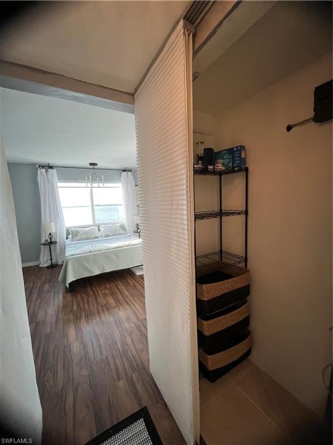 Walk-in closet looking out towards bedroom | Image 14