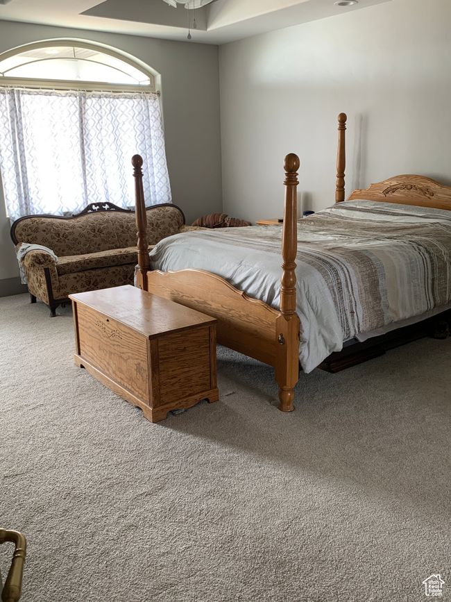 Carpeted bedroom with a ceiling fan | Image 9