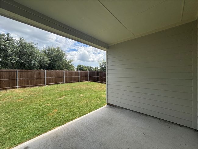 Fenced backyard featuring a patio | Image 13