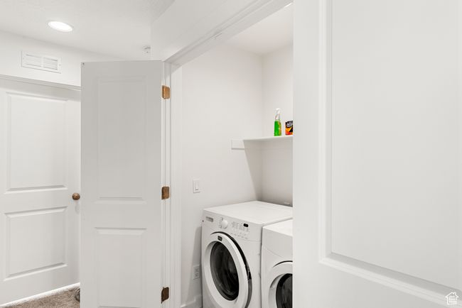 Laundry room featuring laundry area, visible vents, and independent washer and dryer | Image 22