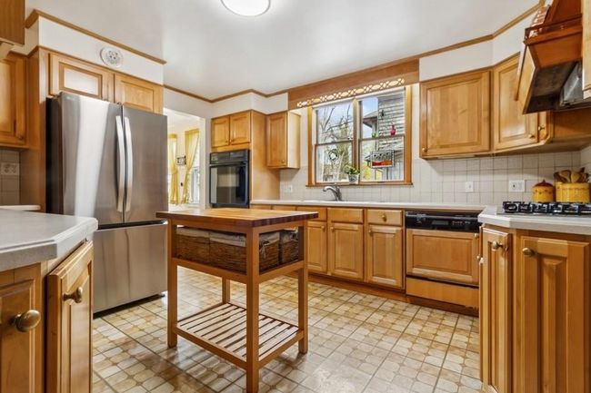 custom built, blond oak kitchen with Butcher block island | Image 12