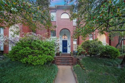 A striking brownstone style townhome with classic architectural design and lush landscaping, provides a tranquil atmosphere. Nestled in Camp Logan, adjacent to Memorial Park, this home enjoys a prime location surrounded by a myriad of dining and entertainment options. Situated in one of Houston's most vibrant neighborhoods, residents have easy access to an array of culinary delights and recreational activities. | Image 1