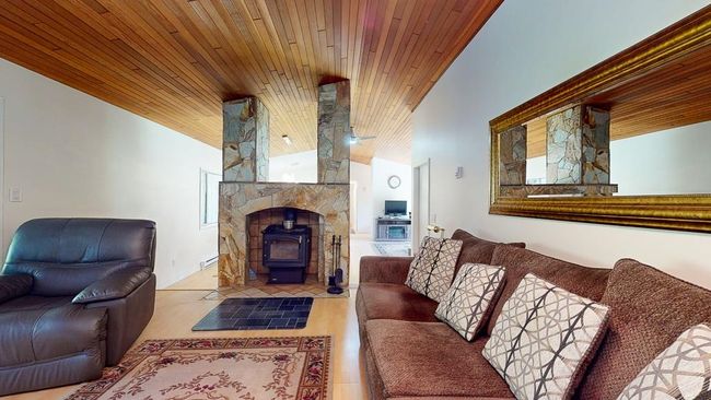 Has a cozy wood stove | Image 25