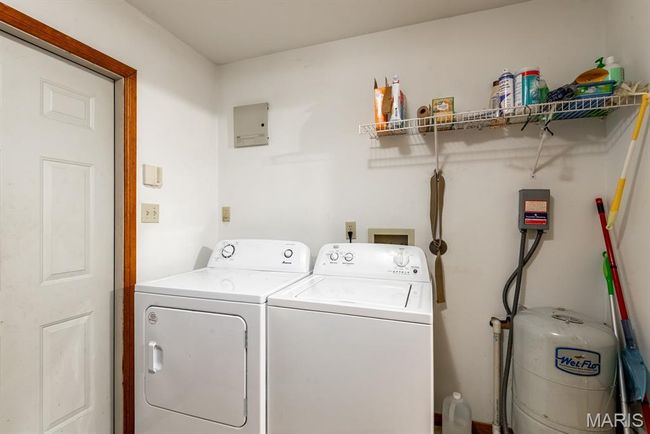 Laundry area featuring independent washer and dryer | Image 10