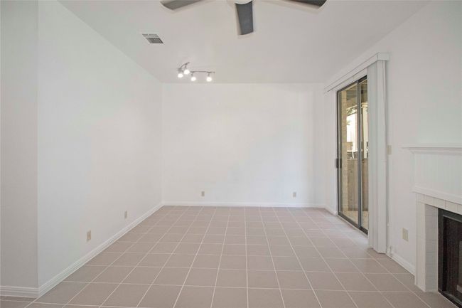 Living and Dining Combo with Sliding door to Private downstairs courtyard and WBFP. | Image 23