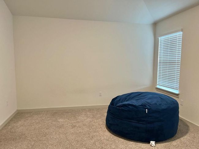 Sitting room with carpet flooring, baseboards, and vaulted ceiling | Image 12