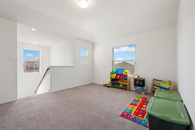 Game room with carpet flooring and baseboards | Image 26