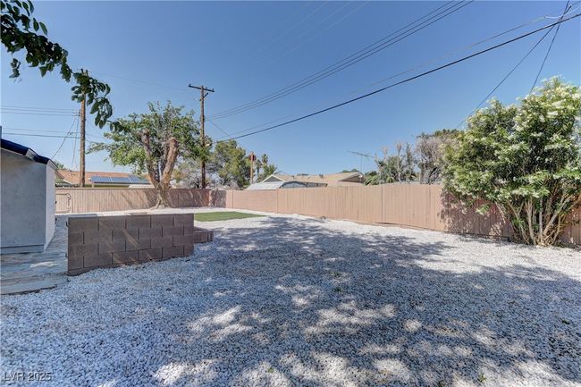View of fenced backyard | Image 33