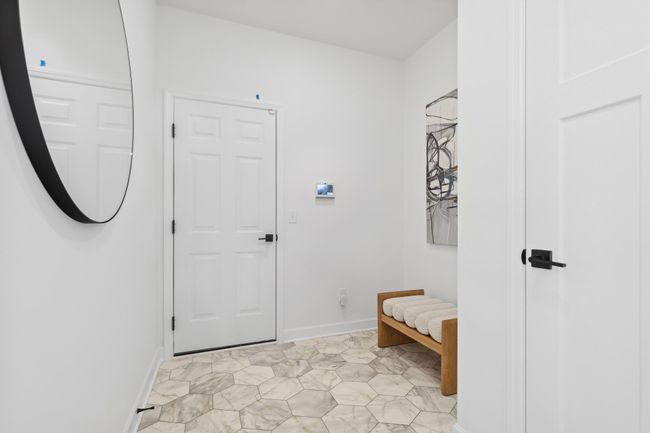 (Photo of a decorated model, actual homes finishes will vary) The main level mudroom. | Image 7