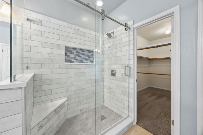Updated bathroom with stylish walk in shower and walk in closet. | Image 15
