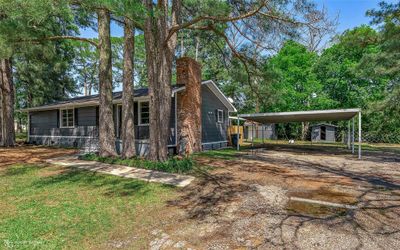 View of front of home with a front lawn and a storage shed | Image 3