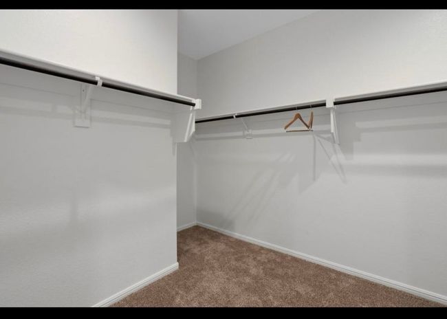 Spacious closet featuring carpet | Image 10