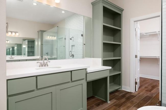 Full bathroom with vanity, recessed lighting, a shower stall, a walk in closet, and wood finished floors | Image 20