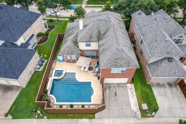 View from above of property featuring the pool and home | Image 9