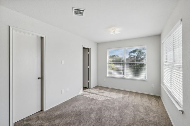 Unfurnished bedroom with carpet flooring and baseboards | Image 10