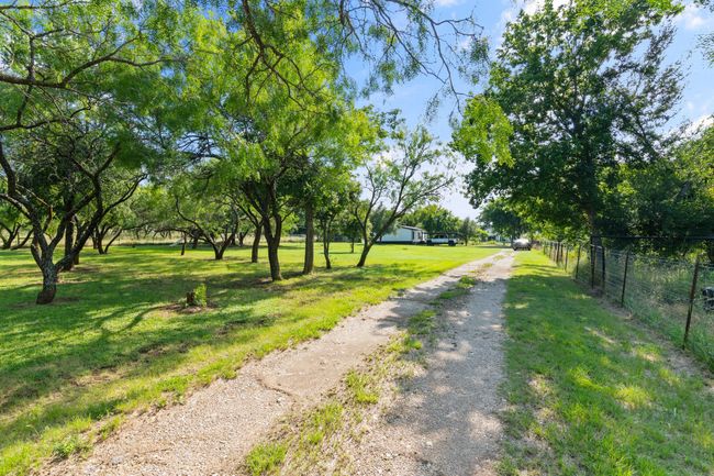 View of dirt / gravel driveway | Image 34