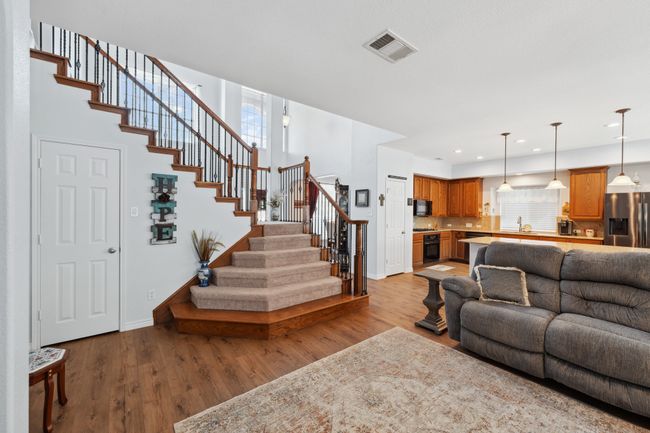 Another view living area with oversized closet and grand entrance to upstairs. | Image 7