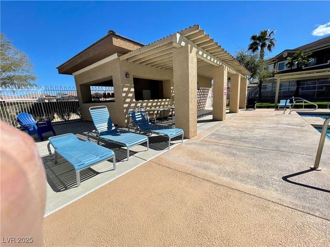 View of patio / terrace featuring a pergola, a community pool, and fence | Image 52