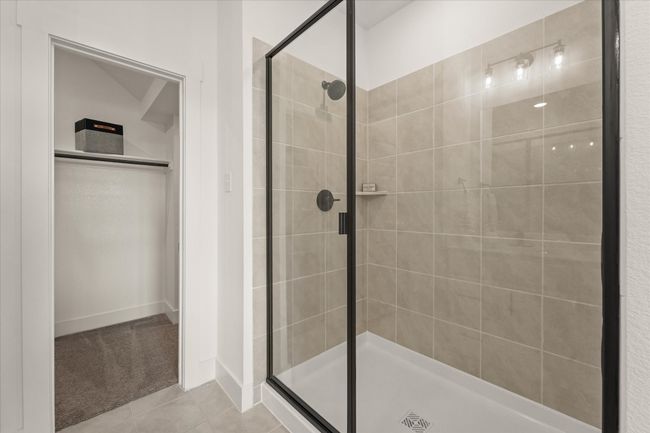Large shower and the entrance to the walk in closet | Image 8