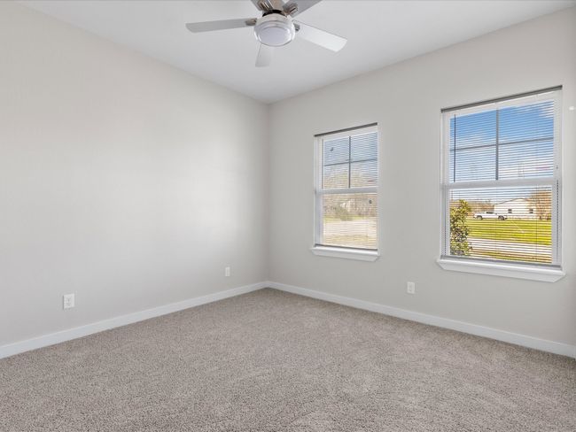 Carpeted spare room with baseboards and ceiling fan | Image 15