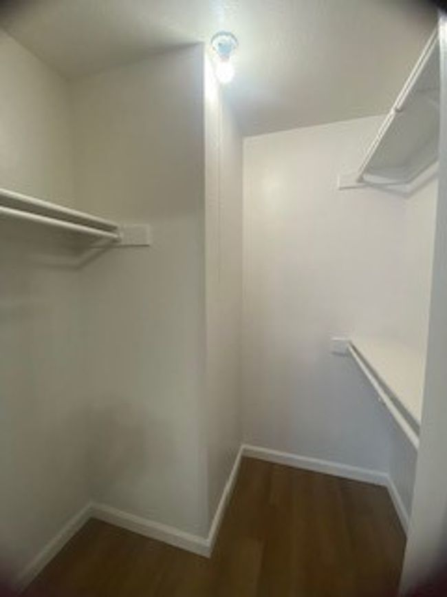 Walk in closet with wood finished floors | Image 20
