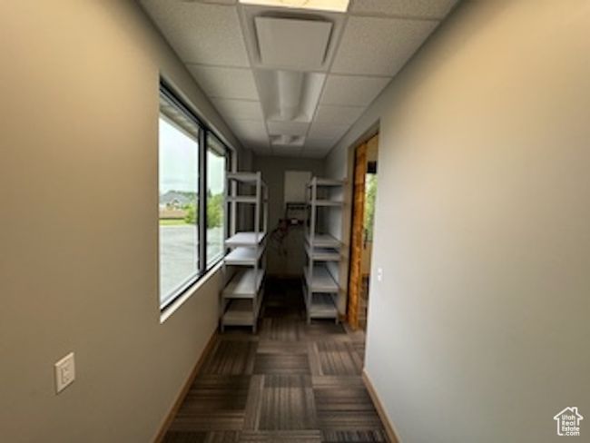 Hall with baseboards and a paneled ceiling | Image 19