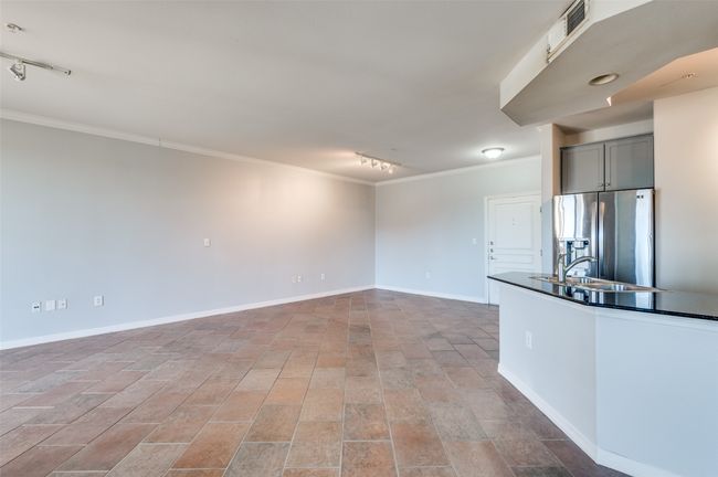 Dining room conveniently located adjacent to kitchen with large wrap around granite countertops | Image 18