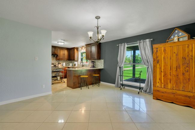 This home offers great light in every room. Large windows and great views to the front yard. | Image 9