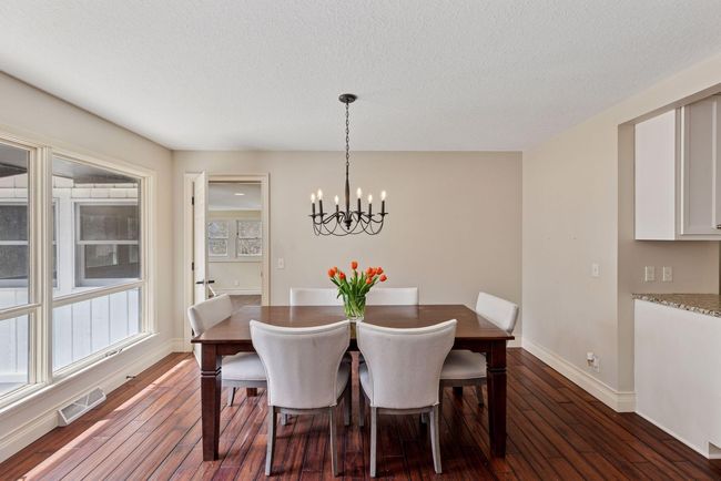 Large dining space open to kitchen and living room area, perfect for entertaining. | Image 8