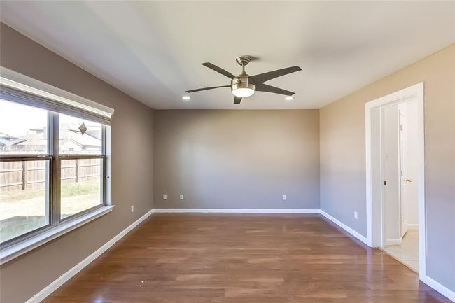 Empty room featuring wood finished floors, a ceiling fan, and recessed lighting | Image 20