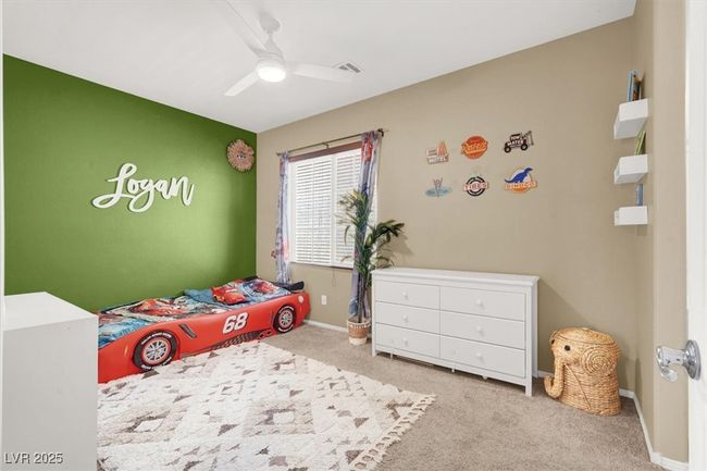 Bedroom with carpet flooring, baseboards, and ceiling fan | Image 14