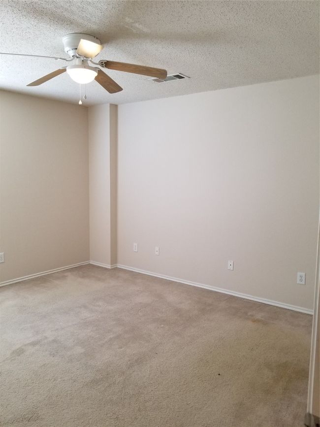 Spare room featuring a ceiling fan and carpet | Image 17