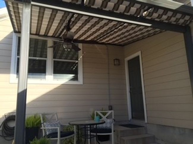 View of patio with ceiling fan | Image 9