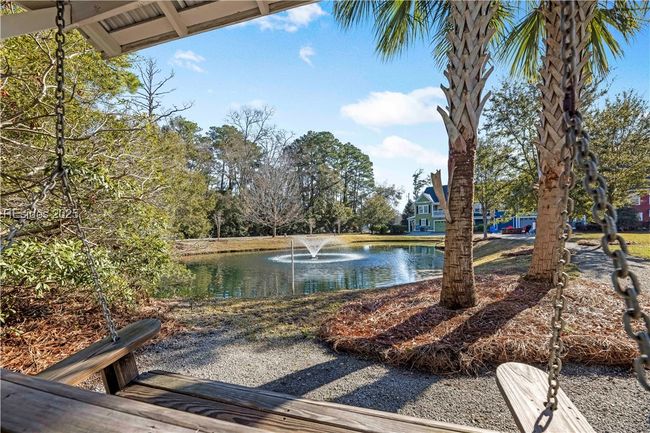 Community bench swing with lagoon views. | Image 39