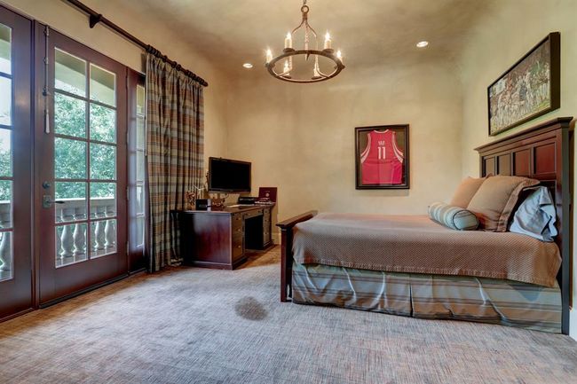 Third bedroom is close to the game room and has a balcony, chandelier, bathroom, walk in closet. | Image 33