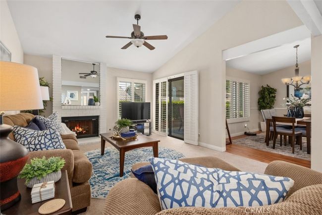 Here you can see the dining room is just off the living room space | Image 14