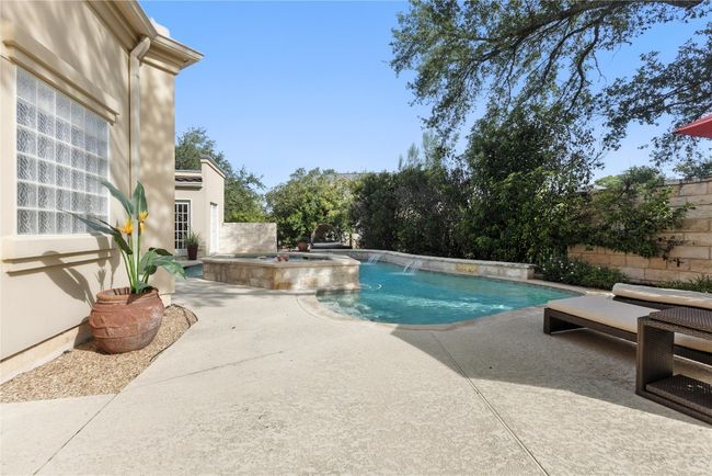 View of pool featuring a patio, a pool with connected hot tub, and a fenced backyard | Image 27