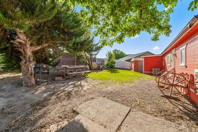 View of yard with a patio area and a shed | Image 20