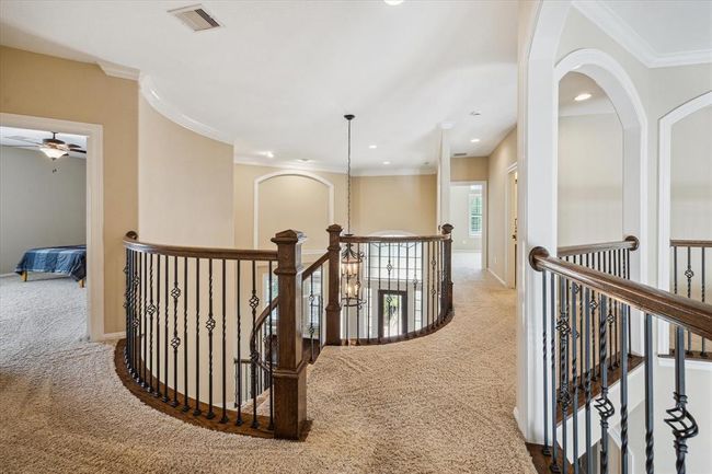 Upstairs you'll find 3 bedrooms, a game room, media room, and built in desk nook | Image 29