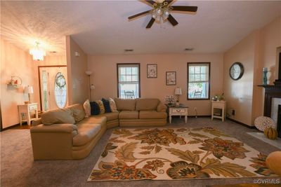 Living room featuring ceiling fan | Image 3