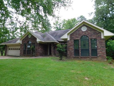 View of front of home featuring a garage and a front yard | Image 2