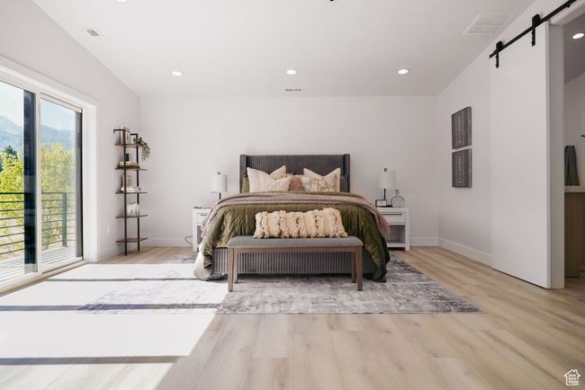 Bedroom featuring a barn door, light wood-style flooring, access to outside, recessed lighting, and baseboards | Image 7