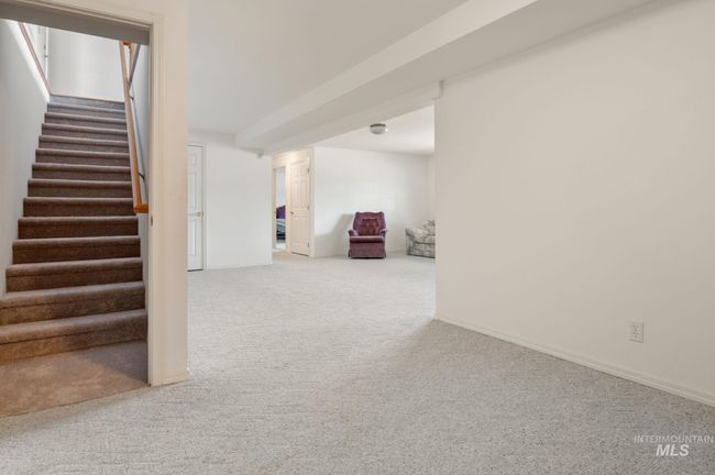 Finished below grade area featuring carpet floors and stairway | Image 22