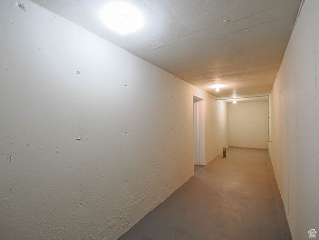 Corridor featuring concrete flooring | Image 51